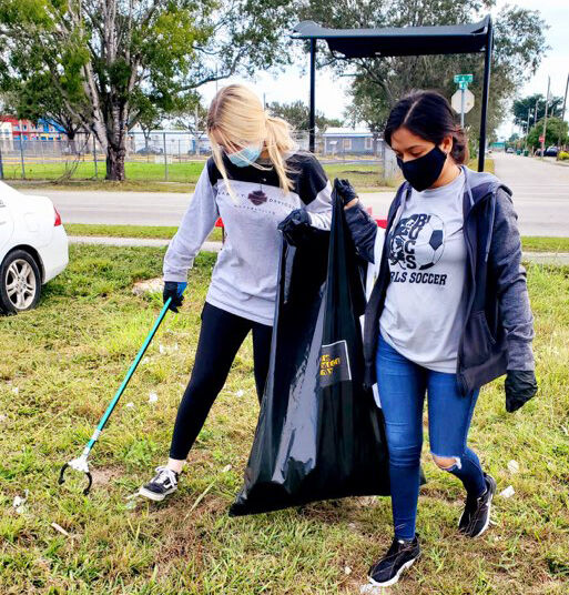 South Dade High School students picking up litter near the block of 14 Street NW 6 Avenue.